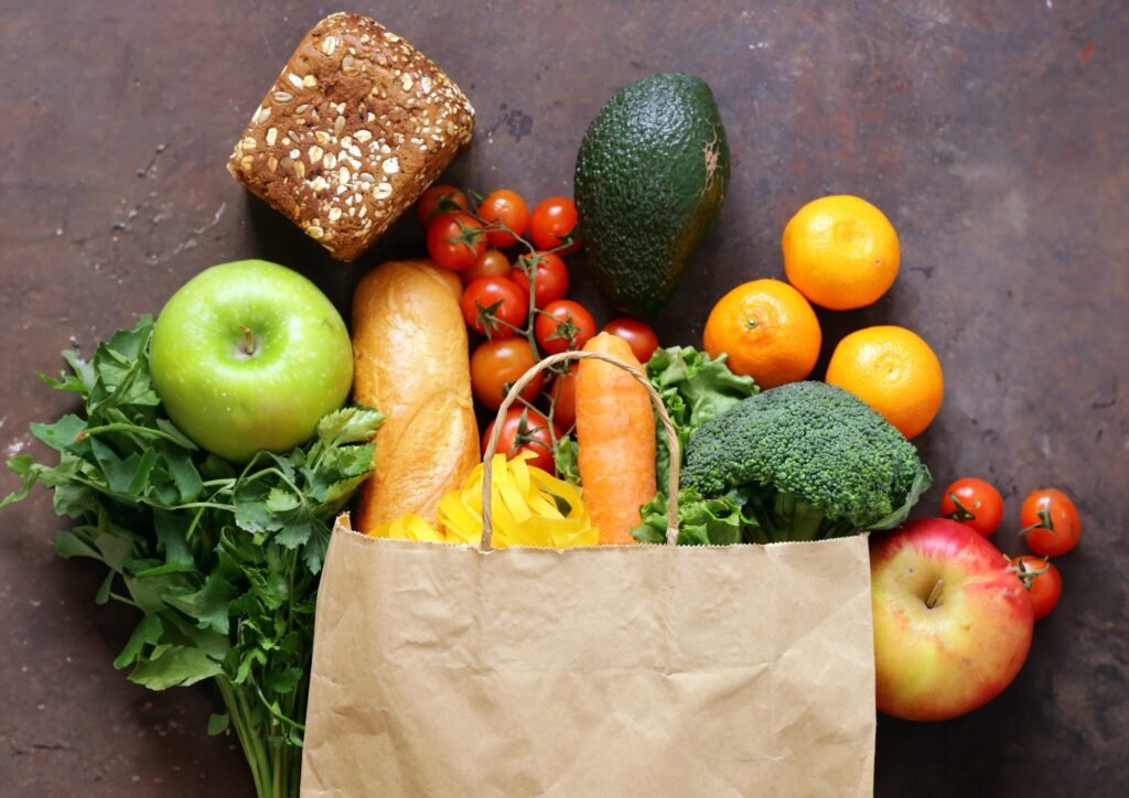 paper shopping bag full of food