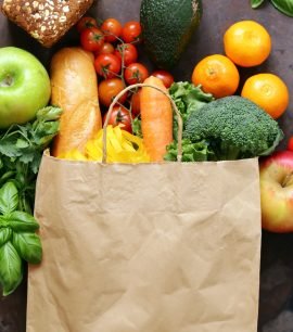 paper shopping bag full of food